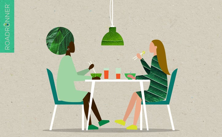 two people at a restaurant admire the restaurant's recent moves to sustainability