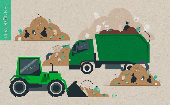 a bulldozer and dump truck move trash around in a landfill